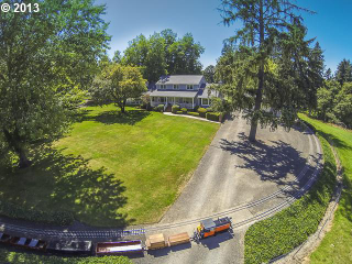 Illustration for article titled This house has a freaking train you can ride all around the property
